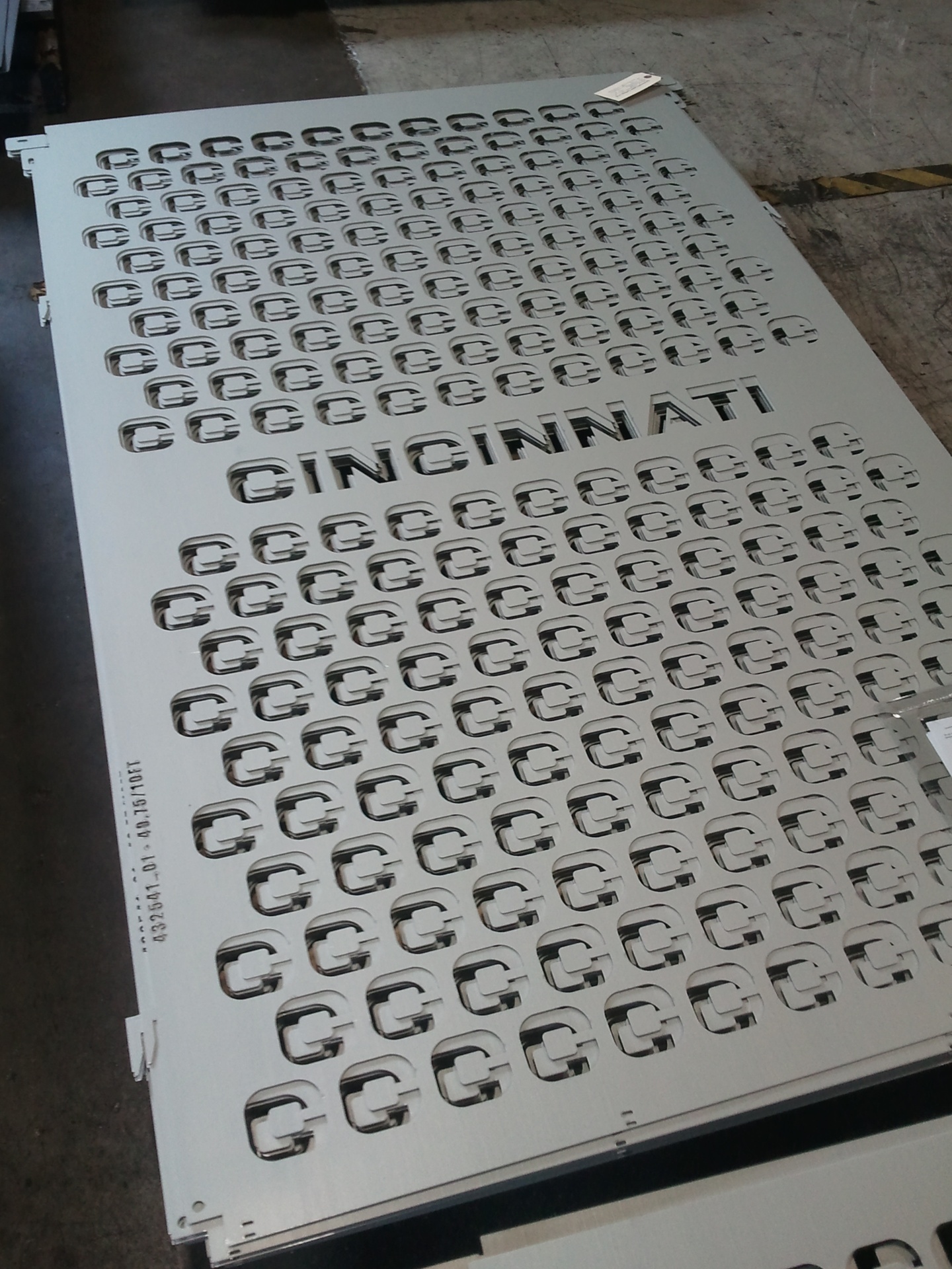 CNC perforated panel with branded cutouts
