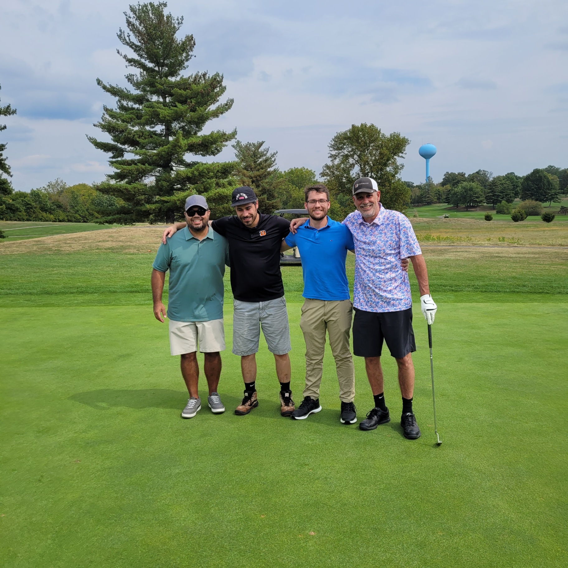 CMF team foursome on the golf course