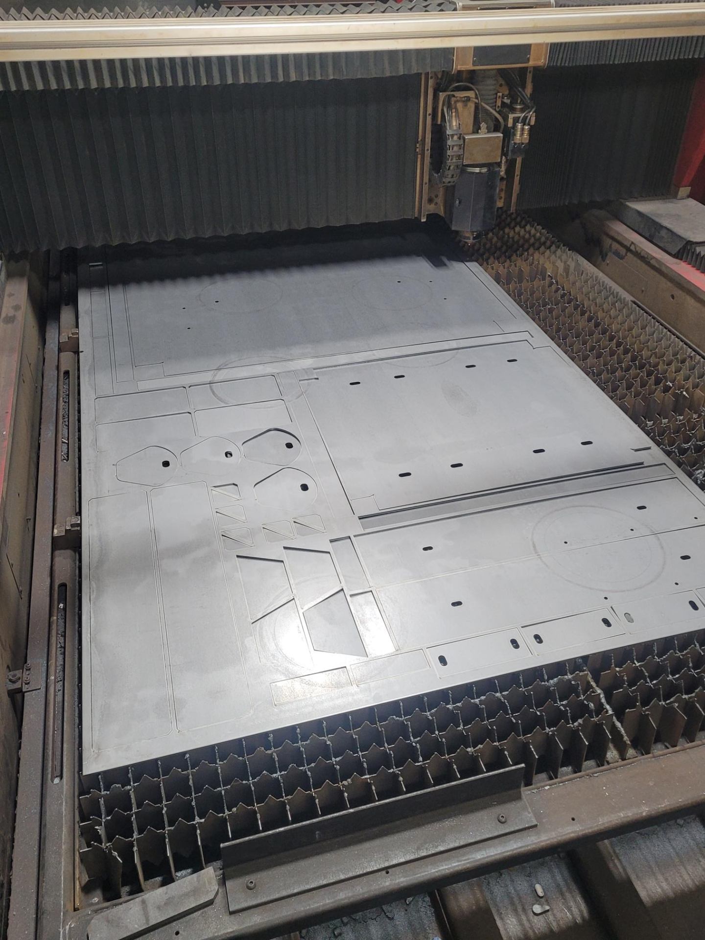 Nested parts on laser bed