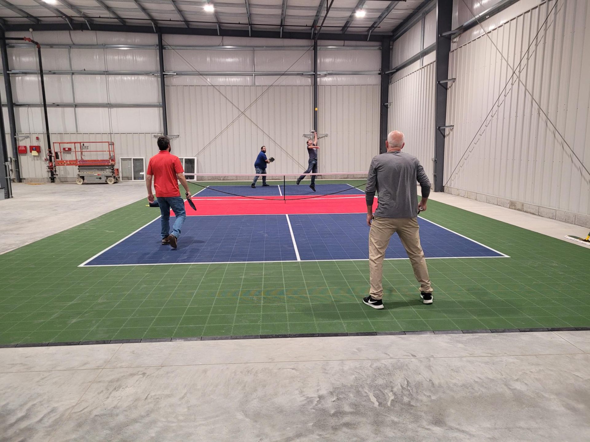 Team members enjoying a pickleball match