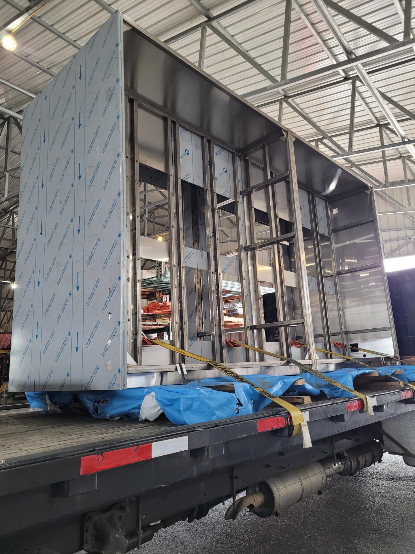 Large stainless steel assembly on flatbed for delivery