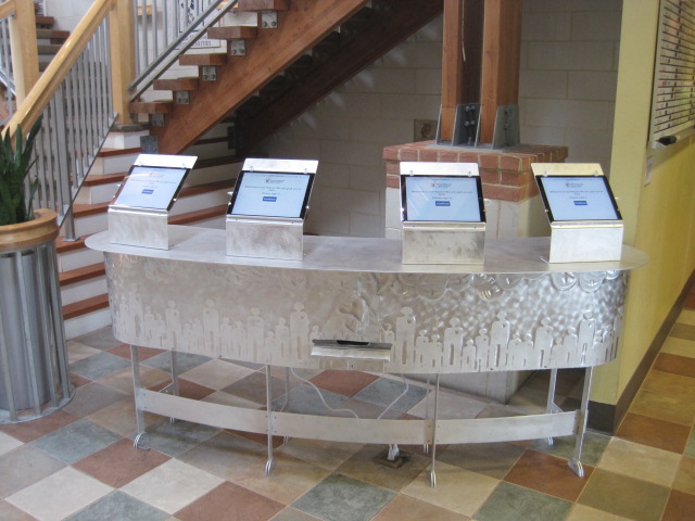 Custom stainless steel kiosk desk with decorative panels