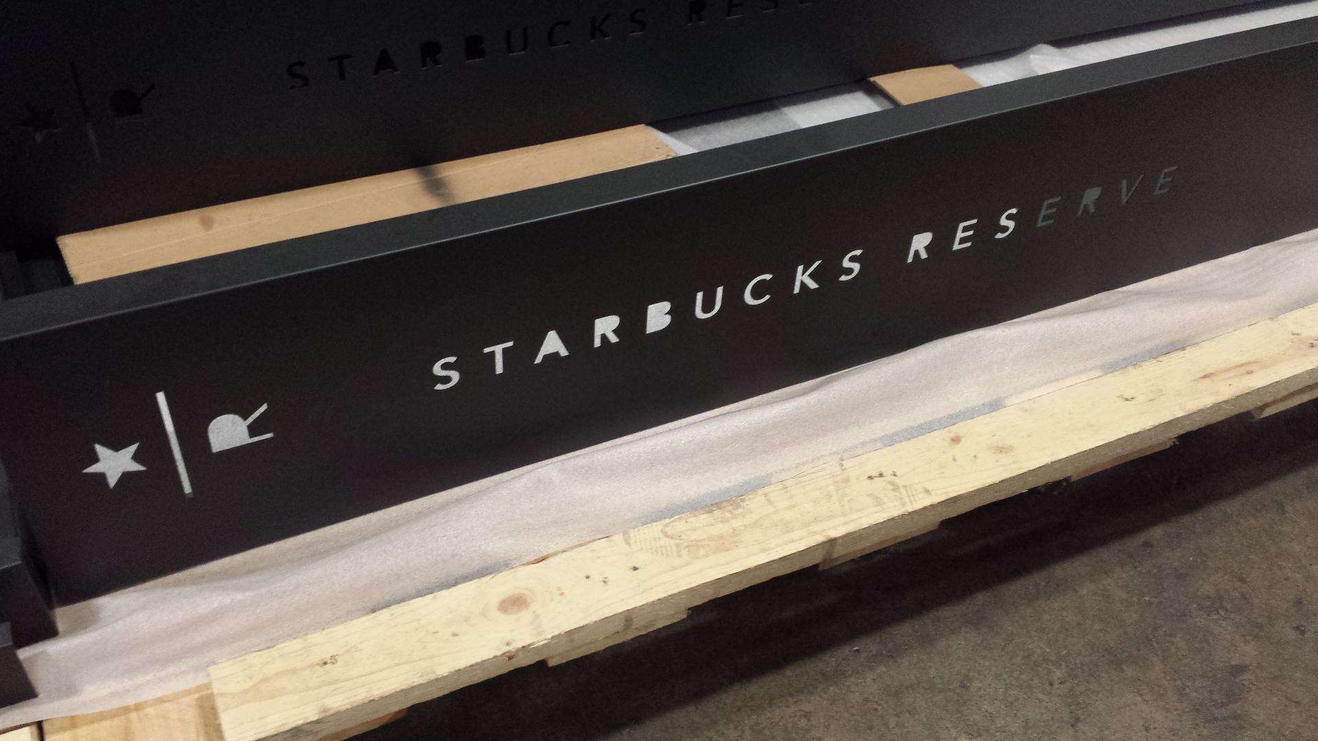 Custom fabricated metal signage ready for shipping