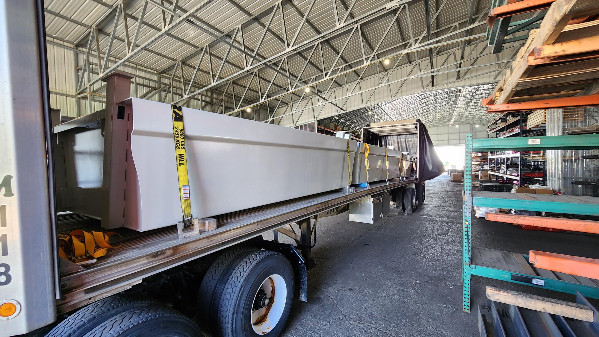 Large fabricated components loaded for delivery