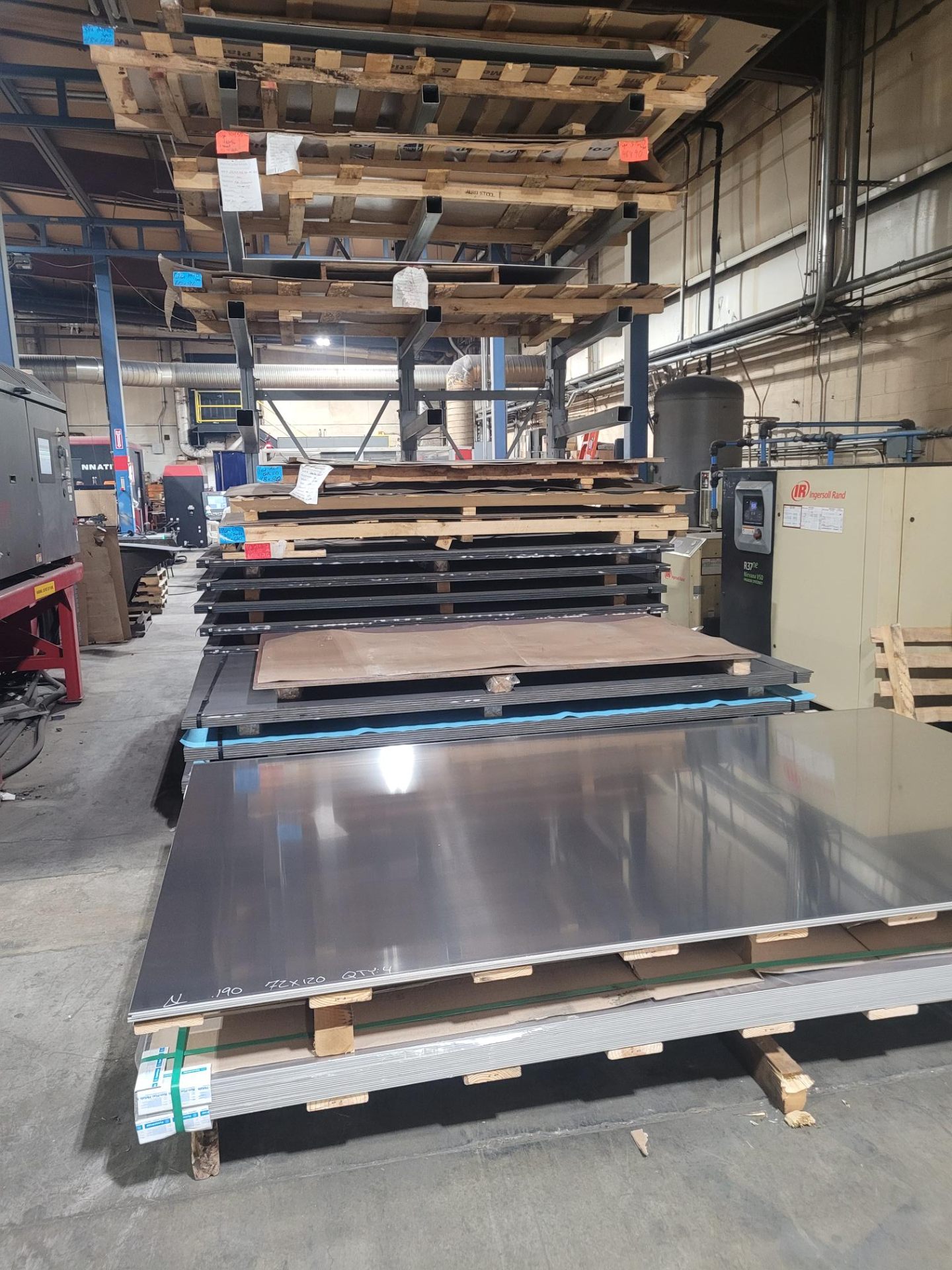 Stainless steel sheets stacked in warehouse