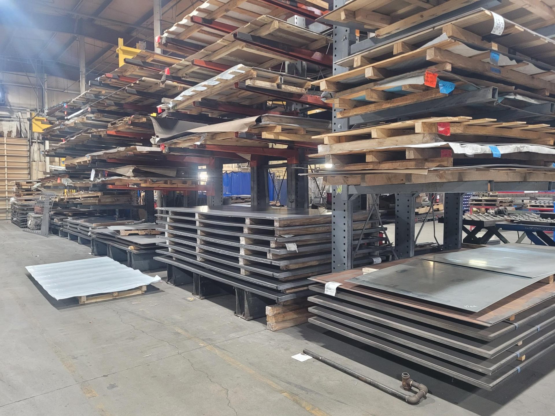 Extensive steel sheet inventory on industrial racks