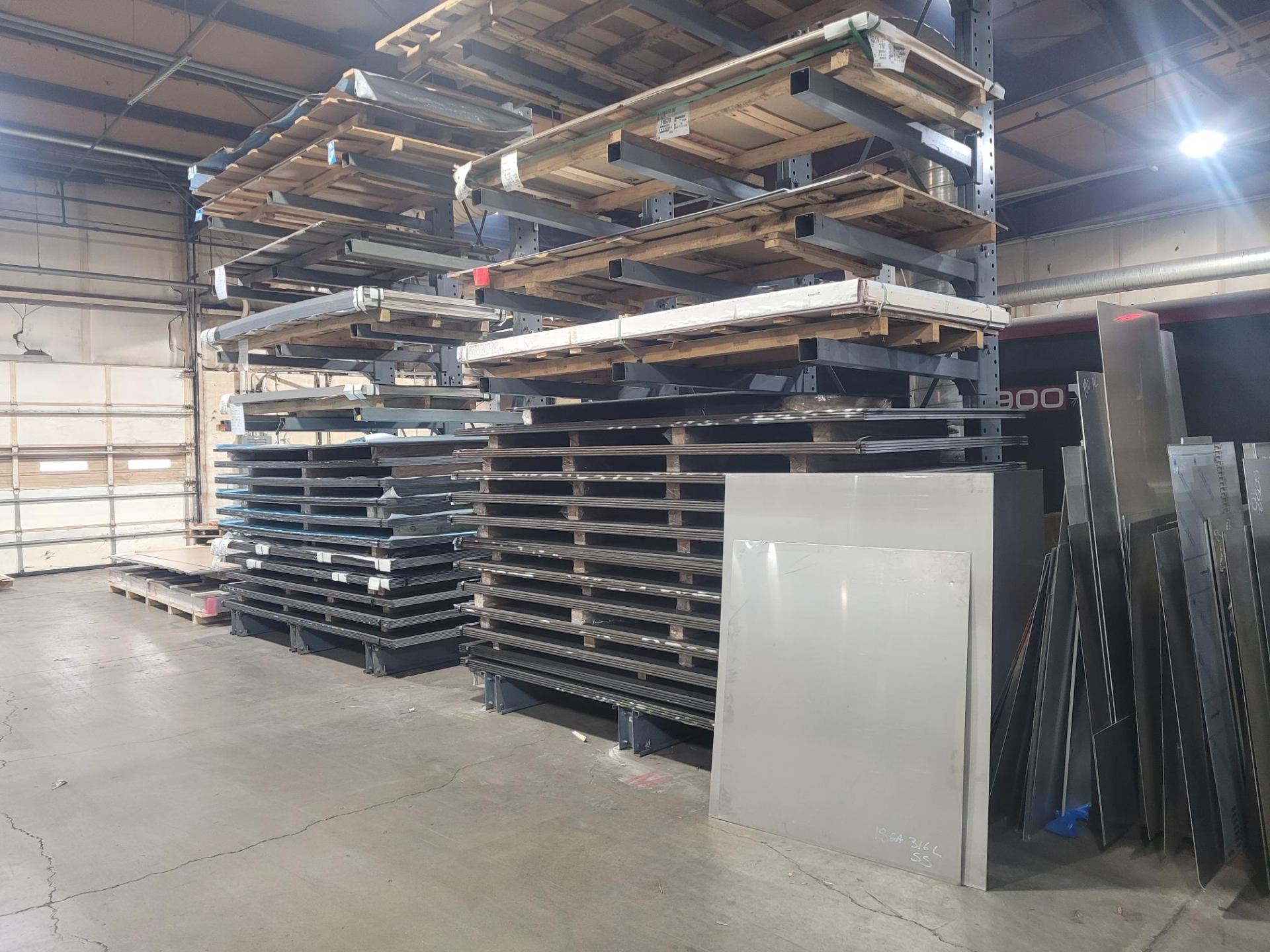 Stacked steel sheets on pallets ready for production