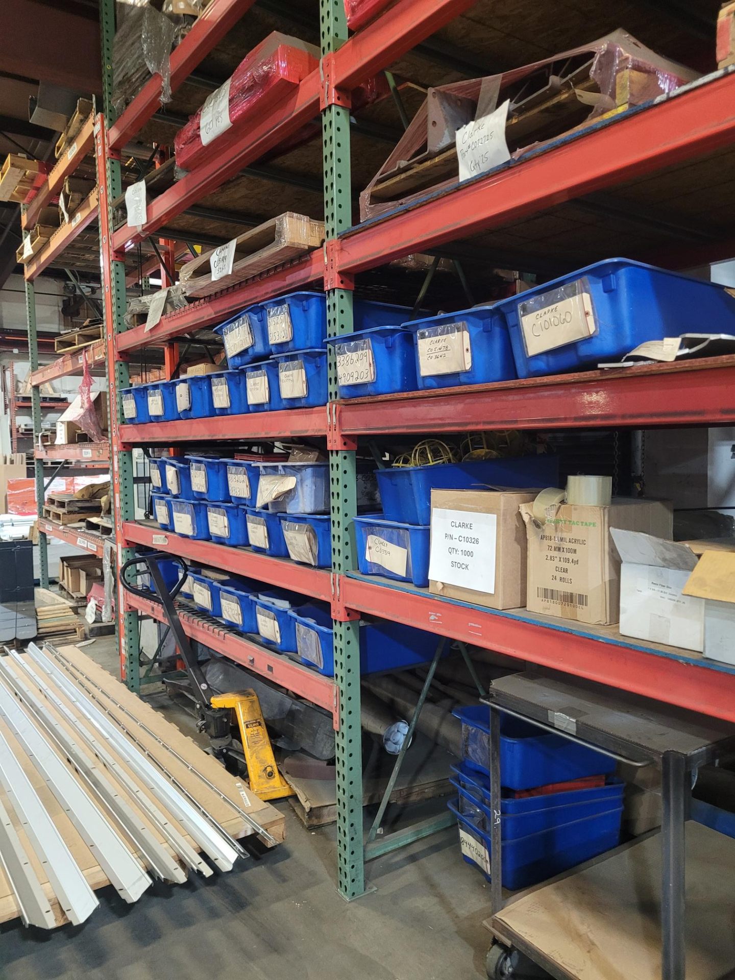 Industrial shelving with labeled bins and components