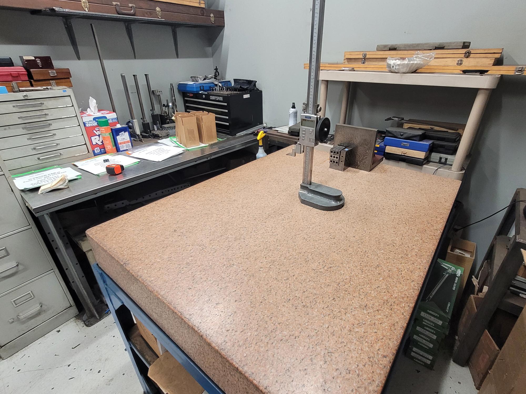 Granite surface plate with precision measuring tools